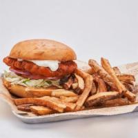 Buffalo Chicken Sandwich · Crispy chicken breast tossed in Buffalo sauce, served with lettuce, tomato, red onion and bl...