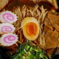 Shoyu Ramen · Clear chicken and fish broth seasoned with our own blend on soy sauce. Topped with naruto fi...