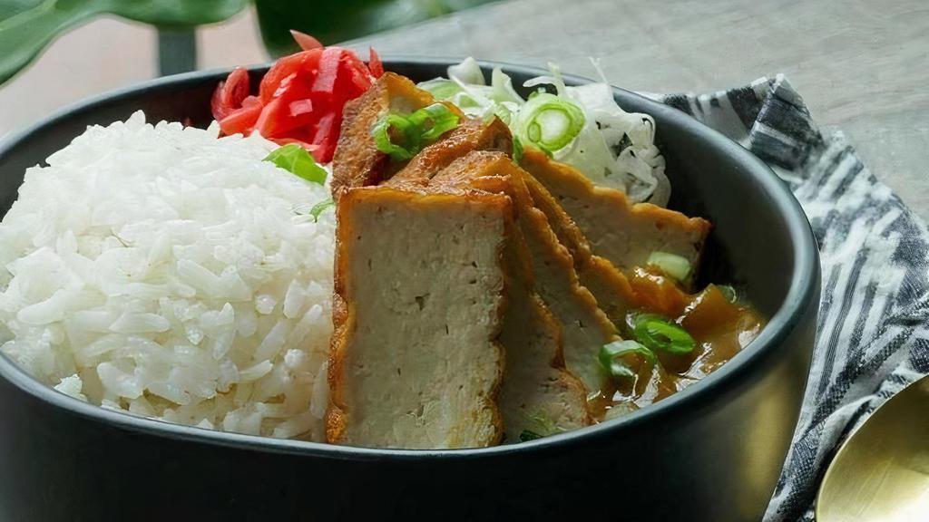 Japanese Curry W/ Tofu · Delicious mild Japanese curry with potatoes and carrots, on top of steamed rice. Served with fried marinated tofu.