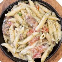 (I) Creamy Pesto Individual · penne noodles with creamy pesto sauce, marinated tomatoes, and fresh mushrooms.