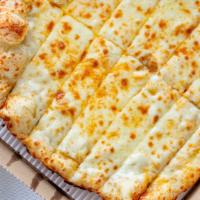 Cheese Bread · Buttered bread covered in cheddar  and mozzarella cheese.  Comes with dipping sauce