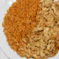Arroz Con Pollo · Grilled seasoned tender chicken over mexican rice and topped with cheese sauce.