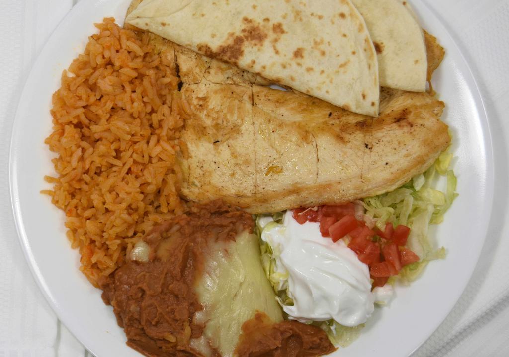 Pollo Loco · Favorite plate. Seasoned grilled chicken breast. Served with rice, beans, tortilla, lettuce and sour cream.
