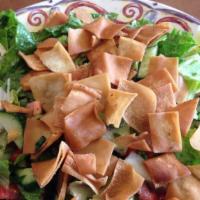 Fattoush Salad · Romaine lettuce, tomato, parsley, green pepper, radish and cucumber tossed with fattoush dre...