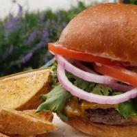 Classic Burger · 1/3lb local beef patty on an Amelia's bun with cheddar, mayo, lettuce, tomato and red onion....