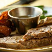 Mama'S Brisket Plate · Locally raised beef brisket slow braised with onions, hand sliced, and served with charred c...