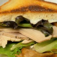 Kids 1/2 Turkey Sandwich · Slow roasted turkey breast on white bread with lettuce, tomato, and mayo