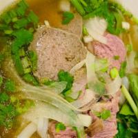 Combo Pho · Combination noodle soup with well done beef, rare beef, meat ball slice, and tendon.