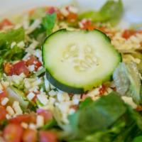 House Salad · Crisp mixed greens with St. Louis-style pizza cheese, tomatoes and cucumber. Served with cho...