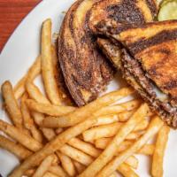 Patty Melt Burger · A 1/3 lb all-natural burger with Swiss and American cheeses and grilled onions on grilled ry...