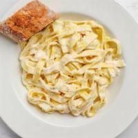 Fettuccine Alfredo Pasta · Fettucine noodles, rich cream sauce,
with imported Parmesan cheese, butter and cream.
Topped...