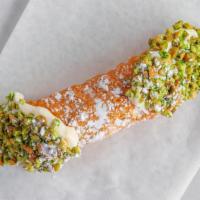 Cannoli · Sweet, creamy Ricotta & chocolate chip filling, topped with nuts, in cannoli shell.