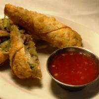 Egg Rolls · Roasted pork, shredded chinese vegetables, and sweet chili dipping sauce.