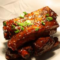 Woo'S Spare Ribs · Marinated ribs coated with a sweet barbeque sauce.