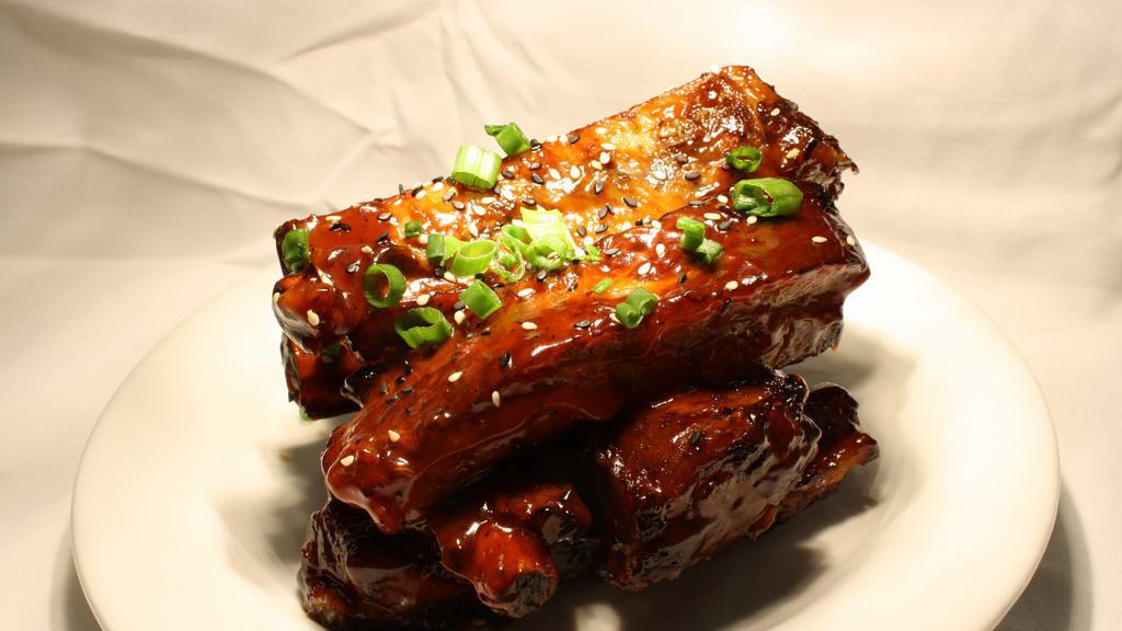 Woo'S Spare Ribs · Marinated ribs coated with a sweet barbeque sauce.