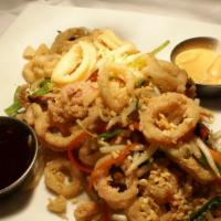 Kung Pao Calamari · Crispy fried calamari, peanuts, snow peas, sprouts, peppers, carrots, ginger ponzu sauce, an...