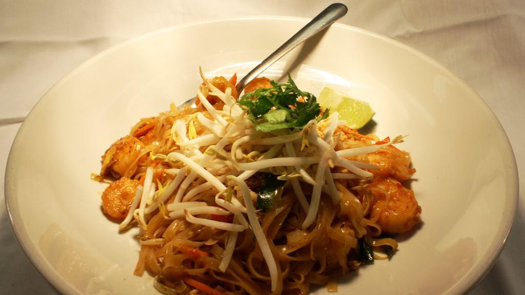 Shrimp Pad Thai · Thin rice noodles, egg, onions, thai basil, bean sprouts, carrots, red peppers, peanuts, scallions, and pad thai sauce.