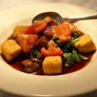 Molly'S Feast · Stir-fried Japanese eggplant, tomatoes, broccoli, green beans, mushrooms, and crispy tofu in...