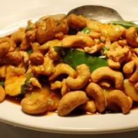 Cashew Chicken · Stir-fried chicken, honey glazed cashews, snow peas, scallions, and water chestnuts in our s...