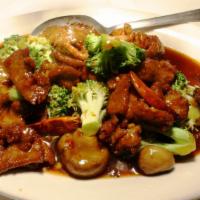 Hunan Beef · Quickly seared beef with broccoli, and mushrooms in a fiery brown sauce.