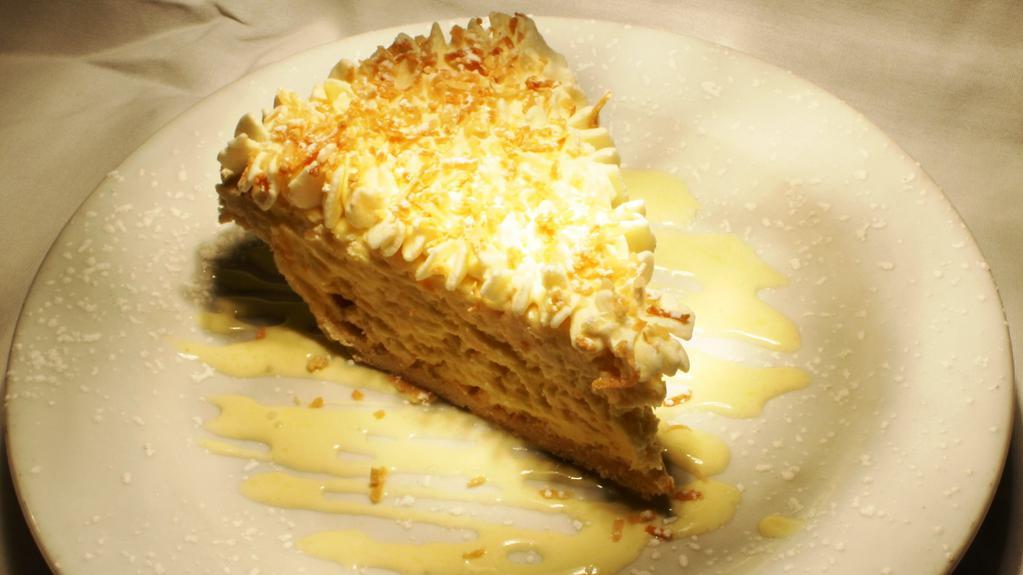 Toasted Coconut Cream Pie · Whipped cream and chocolate sauce.