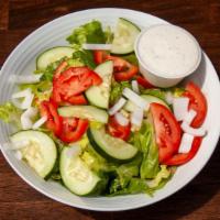 House Salad · Chopped romaine, grated parmesan, fresh tomatoes, cucumbers, red onion with choice of dressing