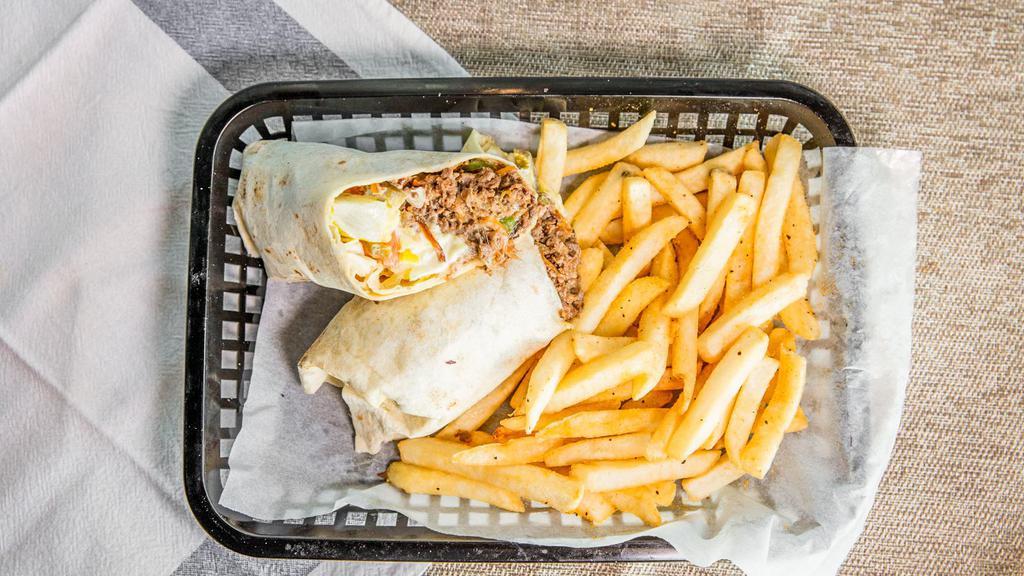 Philly Steak Works Wrap · 100 percent steak, grilled onions, green peppers, mushrooms with choice of cheese and all the toppings wrapped in a flour tortilla shell.