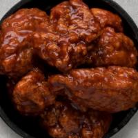 Korean Bbq Boneless Wings · Korean BBQ boneless wings served with celery or carrots, and blue cheese or ranch