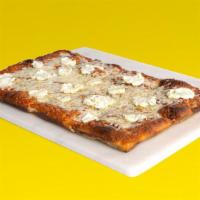 White Pizza · An all white pizza with mozzarella, provolone, parmesan, goat cheese, caramelized onions.