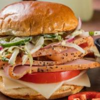 Smoked Turkey Sandwich · Turkey made Famous. Enjoy thick slices of buttery Smoked Turkey on a toasted bun.