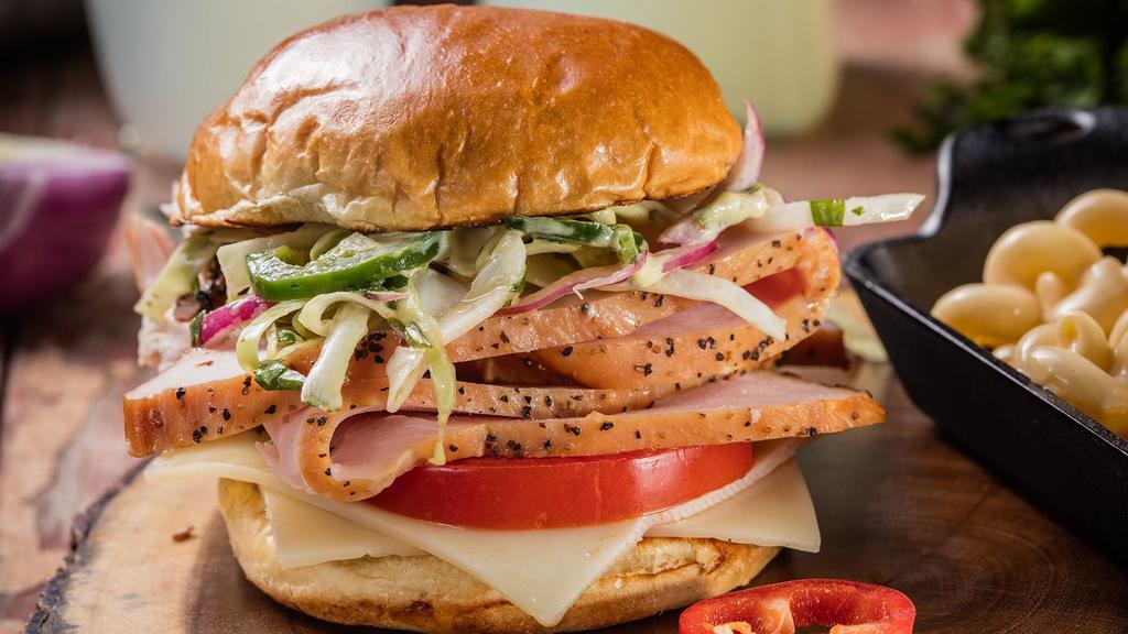 Smoked Turkey Sandwich · Turkey made Famous. Enjoy thick slices of buttery Smoked Turkey on a toasted bun.