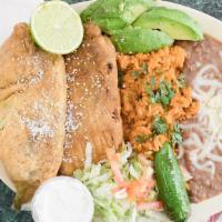 Chile Relleno Dinner · 2 Chile Rellenos Topped With Suiza Sauce Includes: SourCream, Lettuce, Tomatoes