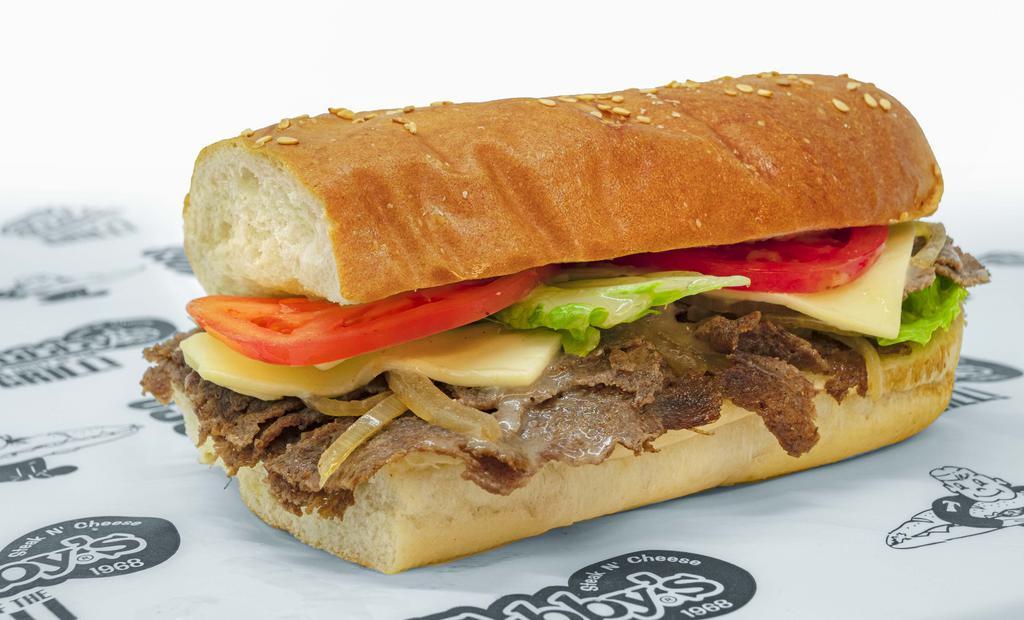 Steak & Cheese · Grilled rib-eye steak, cheese, mushrooms, green peppers, mild peppers, lettuce, onions, tomatoes, and Italian dressing.