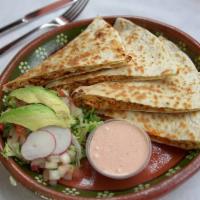 Quesadillas · Cooked tortilla that is filled with cheese and folded in half.