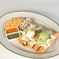 Flautas · Five deep fried corn tortillas stuffed with chicken, smothered in sour cream, lettuce, queso...
