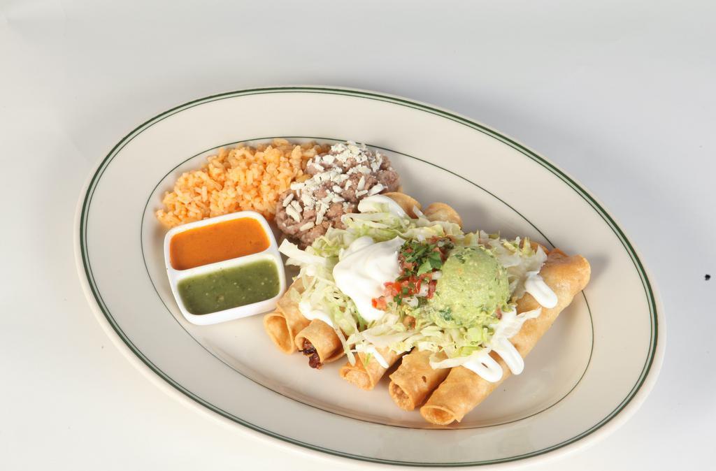 Flautas · Five deep fried corn tortillas stuffed with chicken, smothered in sour cream, lettuce, queso fresco, with a side of rice and beans.