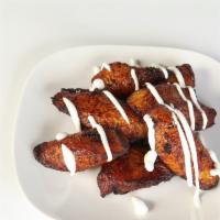 Platanos Fritos · fried plantain served with sour cream, condensed milk and strawberry jelly