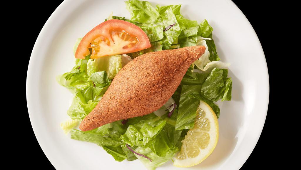 Kibbeh (1) · Finely ground meat and cracked wheat, shaped into a ball and stuffed with seasoned minced meat and onions, and deep fried to a crisp texture.