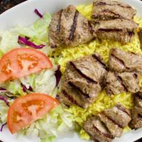 Beef Shish Kabob Entree · Grilled pieces of tender marinated beef (7 pcs) served with rice, salad and pita bread. Add ...