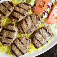 Kefta Kabob Entree · Grilled seasoned ground cuts of tender beef (7 pcs), minced onion and parsley, served with r...