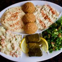 Vegetarian Combination · Combination of falafel, stuffed grape leaves, hummus, baba ghannoug. Jerusalem salad and tab...