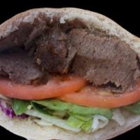 Beef Shawarma Sandwich · Thin slices of lightly seasoned beef cooked on a slowly revolving rotisserie served in a pit...
