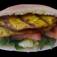 Chicken Tender Sandwich · Marinated Mediterranean style chicken breast tenders, grilled and served in a pita pocket wi...
