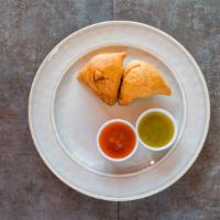 Samosa · A samosa is a deep fried pastry with a savory filling, such as spiced potatoes, onions, beef...