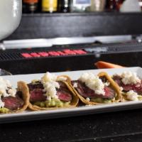 Tacos Jalisco Dinner (4) · 4 delicious charbroiled skirt steak tacos topped with queso fresco, guacamole, cilantro and ...