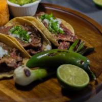 Lomo Taco Dinner · 3 thin cut rib eye tacos topped with your choice of toppings and served with a side of guaca...