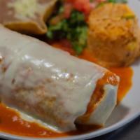 Burrito Suizo Dinner · Stuffed with your choice of meat refried pinto beans, lettuce, tomato, cheese and sour cream...