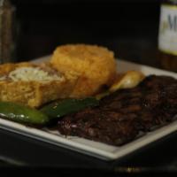 Carne Asada · Charbroiled 9 oz. skirt steak seasoned in our secret rub and served with a grilled jalapeño ...