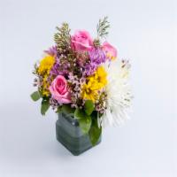 Delightful Seasonal Arrangement · Assorted color flowers, foliage designed in a glass container or vase.