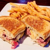 Blue Ribbon Reuben · Tender and delicious! ~ slow-cooked corned beef & kraut served with our special sauce on rye...